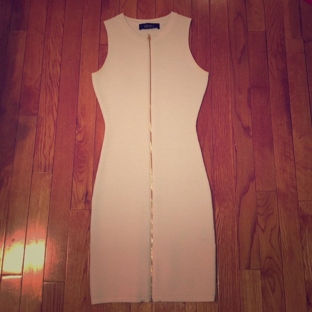 Skin tight white dress gold zipper .